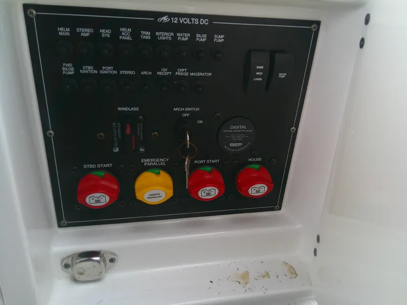 Slide: The Image of Control panel of a 2020 Monterey 305 Super Sport boat, featuring various switches and indicators. - 22