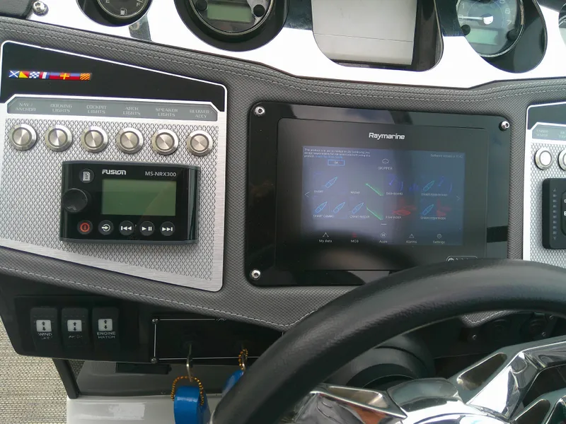 Slide: The Image of Dashboard of 2020 Monterey 305 Super Sport boat with navigation and control systems. - 25