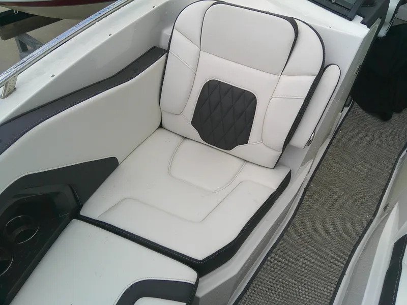 Slide: The Image of 2020 Monterey 305 Super Sport boat interior with white and black cushioned seating. - 29