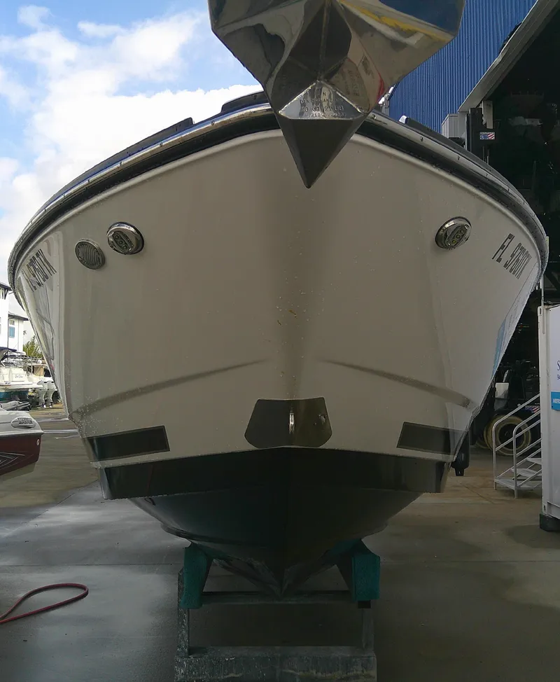 Slide: The Image of 2020 Monterey 305 Super Sport boat in storage, front view. - 34