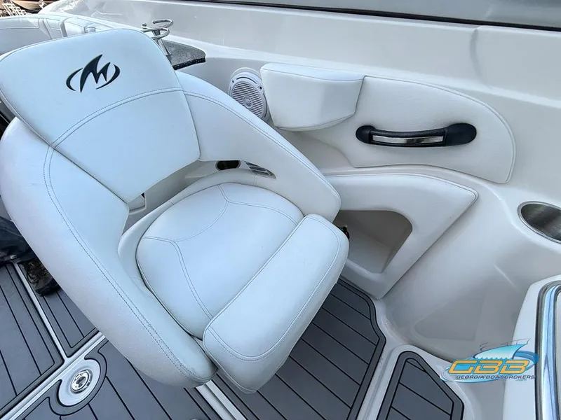Slide: The Image of White leather seat on 2013 Monterey 264FS boat interior. - 13