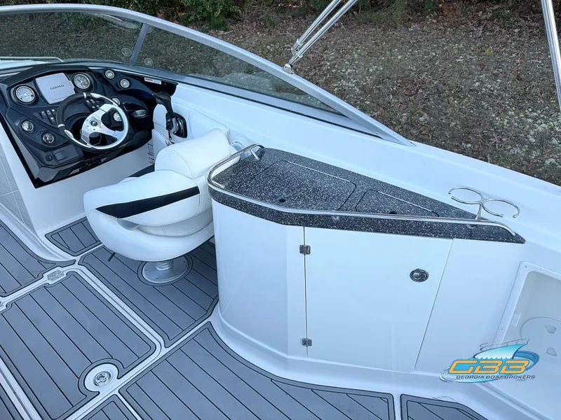 Slide: The Image of 2013 Monterey 264FS boat interior with steering wheel and sleek dashboard design. - 14