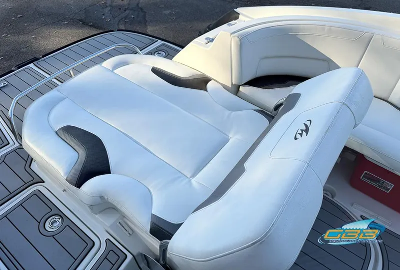Slide: The Image of 2013 Monterey 264FS boat with white leather seating and sleek deck design. - 15