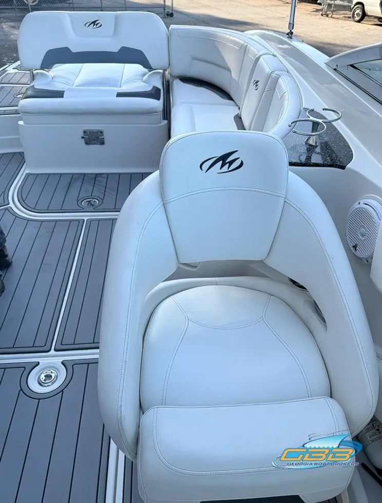 Slide: The Image of 2013 Monterey 264FS boat interior with white leather seating and sleek design. - 20