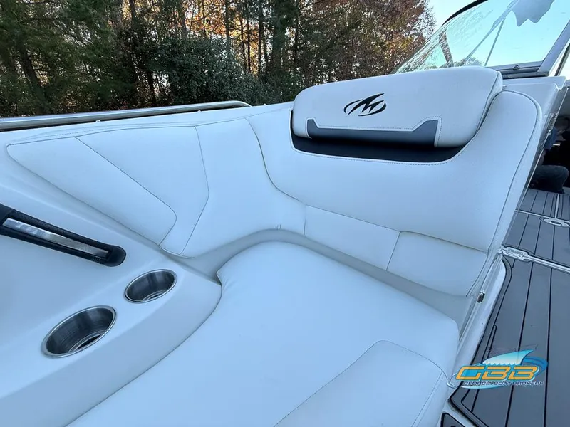 Slide: The Image of 2013 Monterey 264FS boat interior with white seating and cup holders. - 24