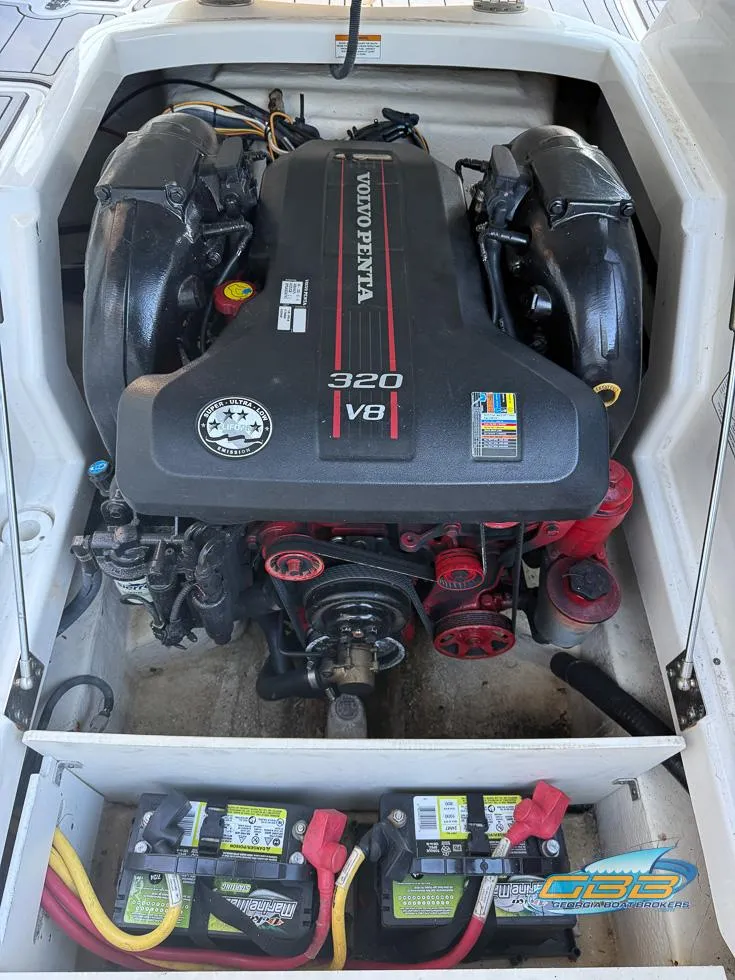 Slide: The Image of 2013 Monterey 264FS boat engine compartment with Volvo Penta 320 V8 engine. - 30