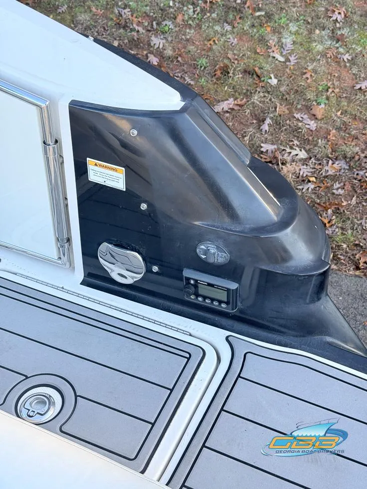 Slide: The Image of 2013 Monterey 264FS boat deck with control panel and logo. - 34