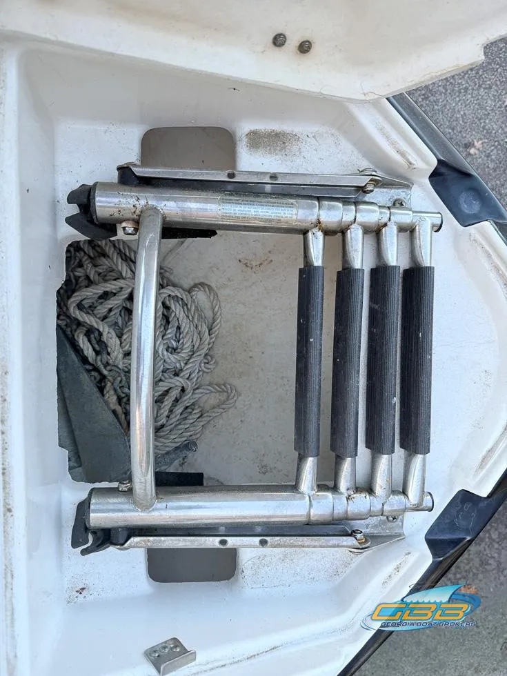 Slide: The Image of Foldable boat ladder on a 2013 Monterey 264FS with rope storage. - 35