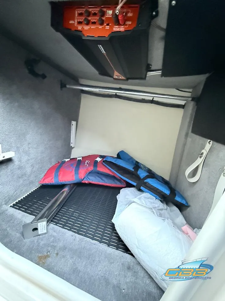 Slide: The Image of Interior storage of 2013 Monterey 264FS boat with life jackets and equipment. - 36