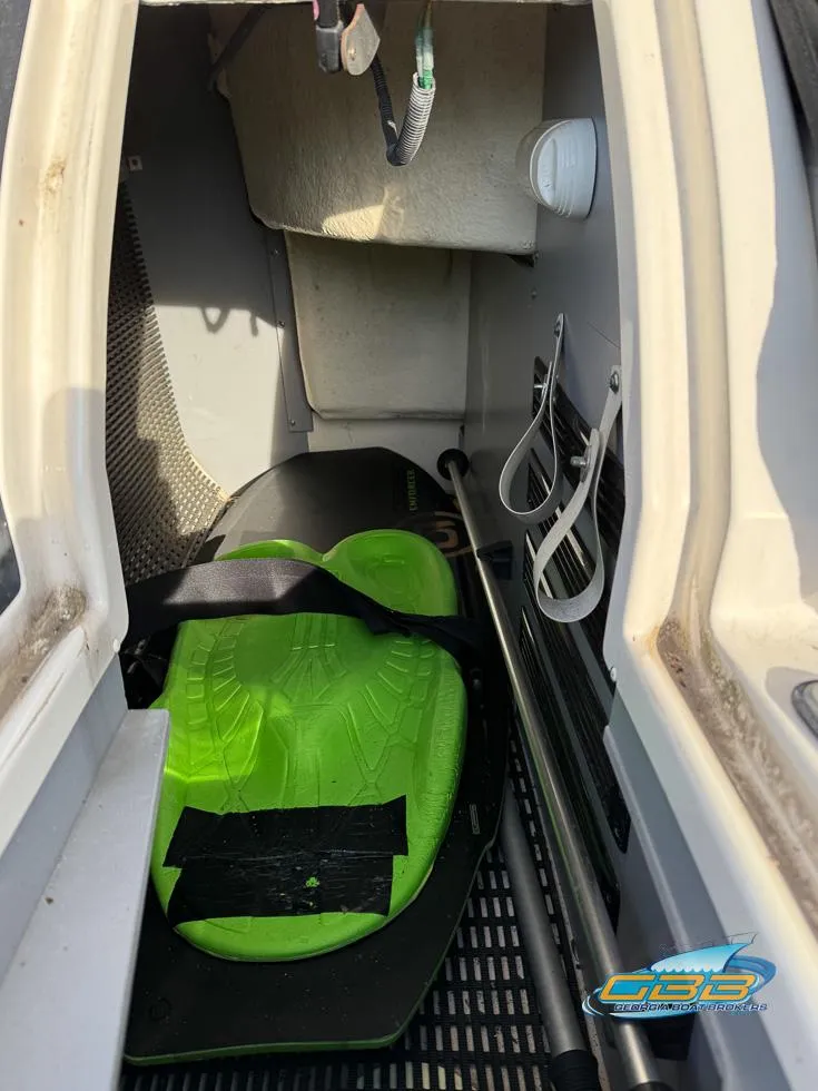 Slide: The Image of Interior of a 2013 Monterey 264FS boat with green wakeboard storage. - 37