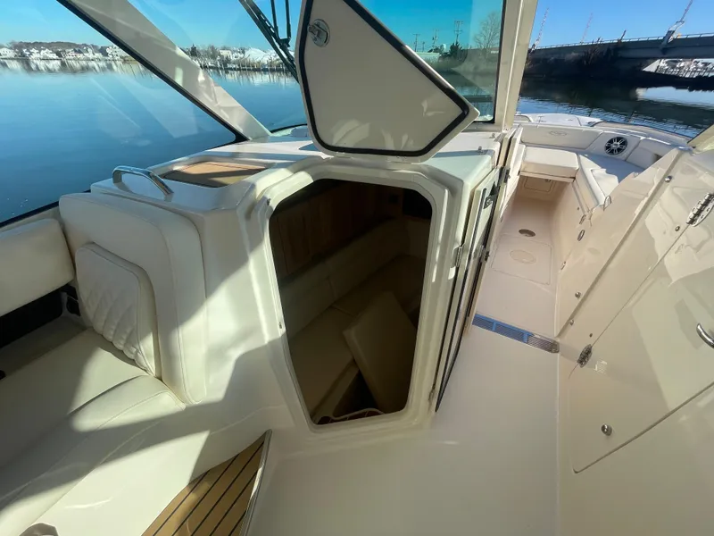 Slide: The Image of 2025 Grady-White Freedom 345 boat interior with open cabin and seating area. - 22