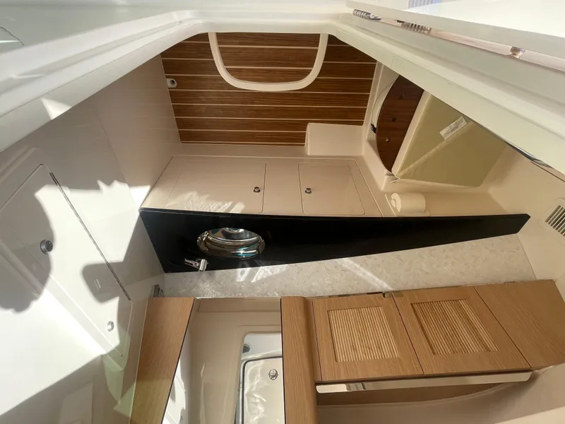Slide: The Image of Interior of 2025 Grady-White Freedom 345 boat, featuring modern cabinetry and sleek design. - 29