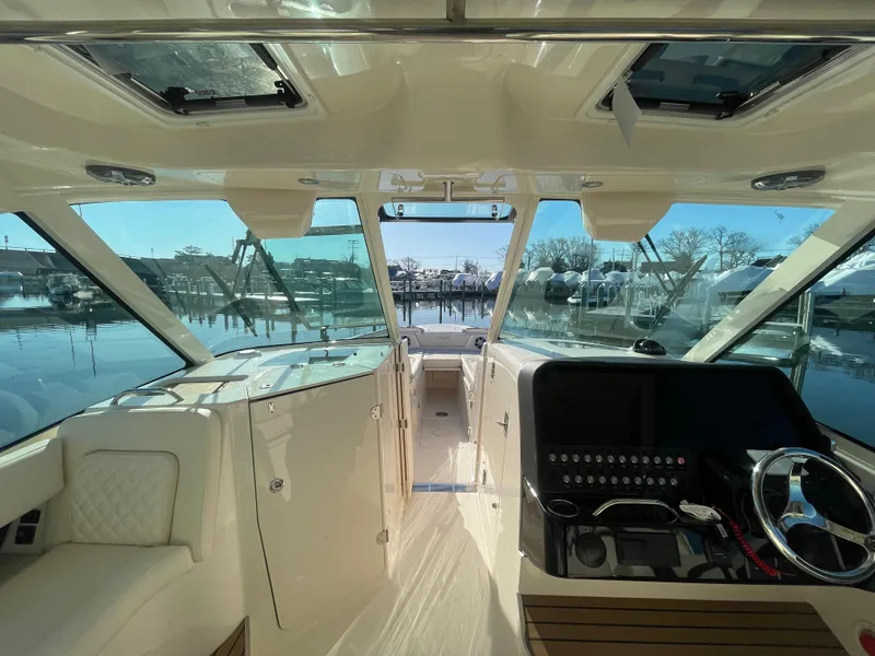 Slide: The Image of Interior view of 2025 Grady-White Freedom 345 boat, showcasing helm and seating area. - 31