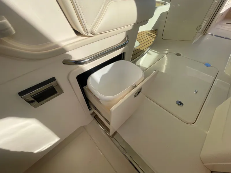 Slide: The Image of 2025 Grady-White Freedom 345 boat interior with pull-out storage compartment. - 37