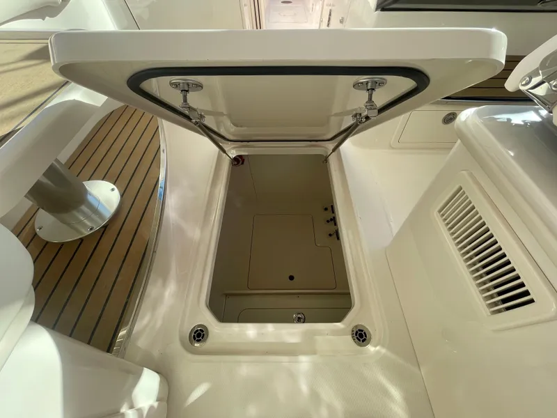 Slide: The Image of 2025 Grady-White Freedom 345 boat storage compartment, open hatch view. - 38