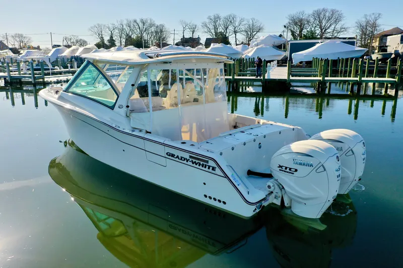 Slide: The Image of 2025 Grady-White Freedom 345 boat with Yamaha engines docked in a marina. - 4