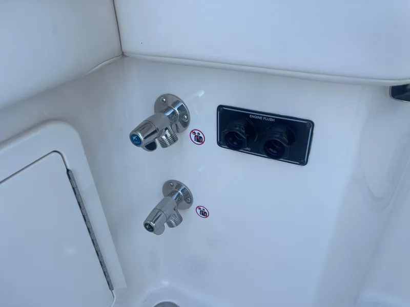 Slide: The Image of 2025 Grady-White Freedom 345 boat controls and outlets on white panel. - 48