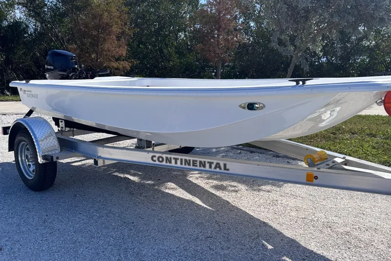 Slide: The Image of 2025 Rabco Buccaneer boat on Continental trailer, parked outdoors. - 4