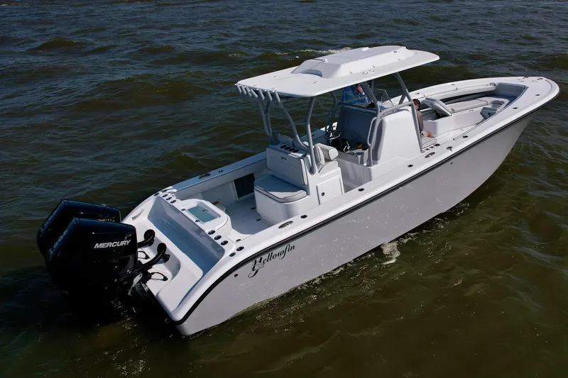 Slide: The Image of 2025 Yellowfin 32 Offshore boat on water, featuring dual Mercury engines. - 10