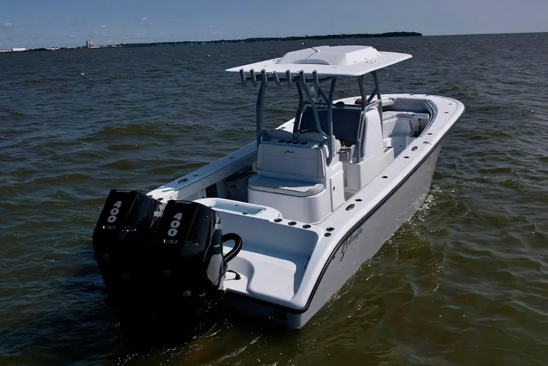 Slide: The Image of 2025 Yellowfin 32 Offshore boat with dual engines on open water. - 11
