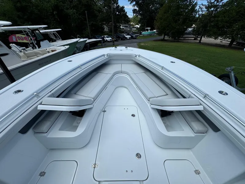 Slide: The Image of 2025 Yellowfin 32 Offshore boat with spacious seating and sleek design. - 14