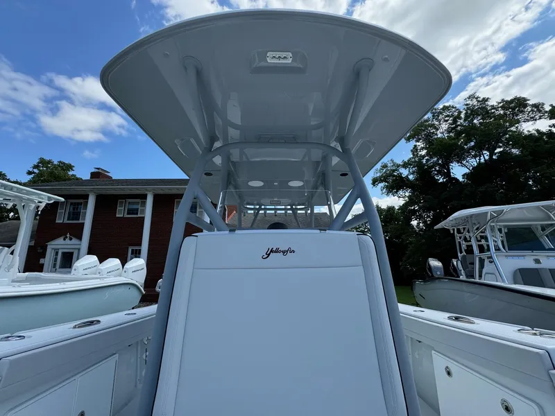 Slide: The Image of 2025 Yellowfin 32 Offshore boat, sleek design, under blue sky. - 18