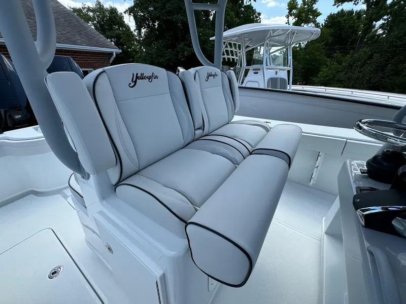 Slide: The Image of 2025 Yellowfin 32 Offshore boat with plush seating and sleek design. - 27