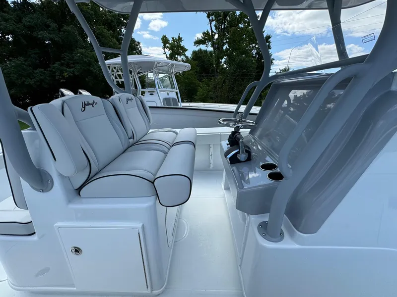 Slide: The Image of 2025 Yellowfin 32 Offshore boat interior with sleek seating and modern console. - 28