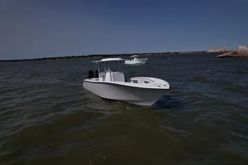 Slide: The Image of 2025 Yellowfin 32 Offshore boat on open water. - 3