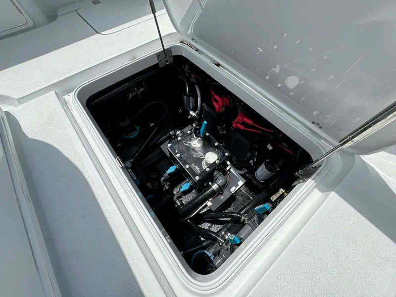 Slide: The Image of 2025 Yellowfin 32 Offshore boat compartment with mechanical components. - 35