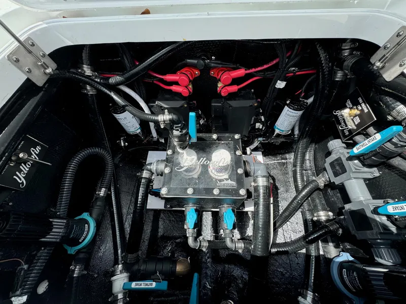 Slide: The Image of Engine compartment of 2025 Yellowfin 32 Offshore boat, showcasing wiring and components. - 36