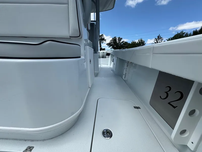 Slide: The Image of 2025 Yellowfin 32 Offshore boat deck, sleek design, clear sky background. - 38