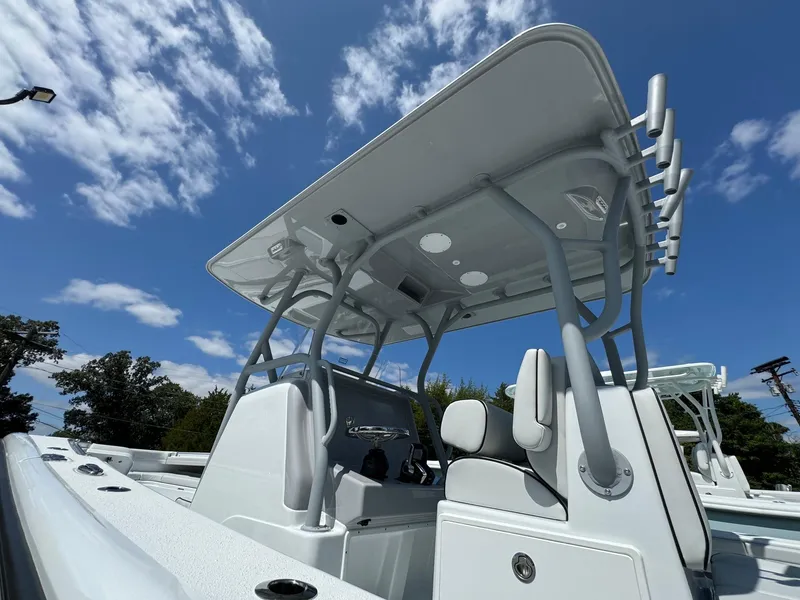 Slide: The Image of 2025 Yellowfin 32 Offshore boat with T-top under blue sky. - 41