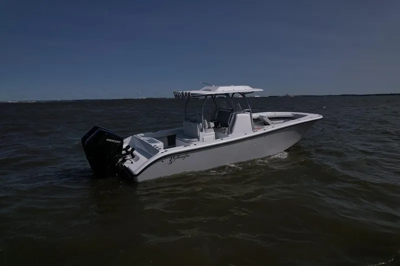 Slide: The Image of 2025 Yellowfin 32 Offshore boat on open water. - 9