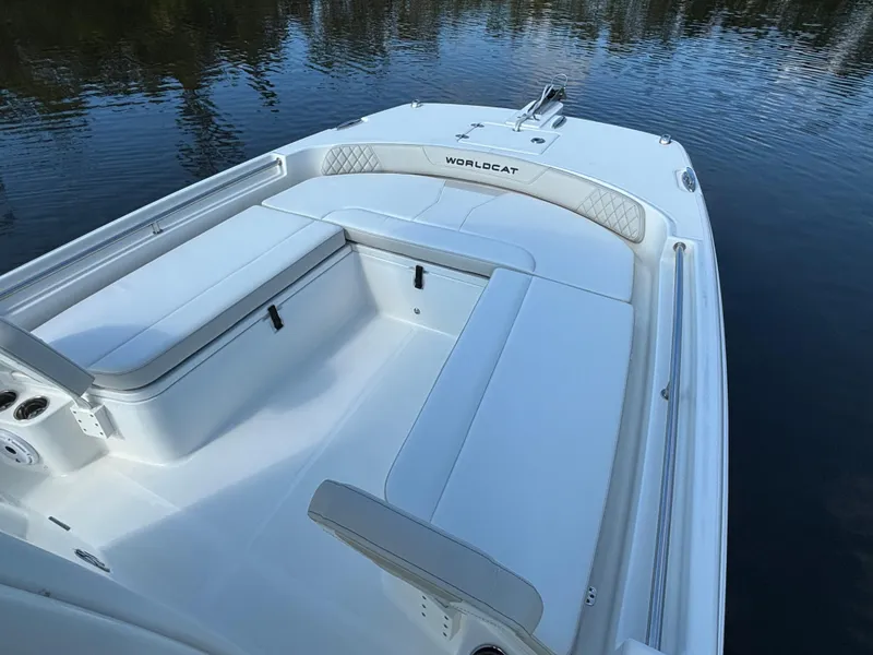 Slide: The Image of 2025 World Cat 235 CC boat with spacious seating on calm water. - 13