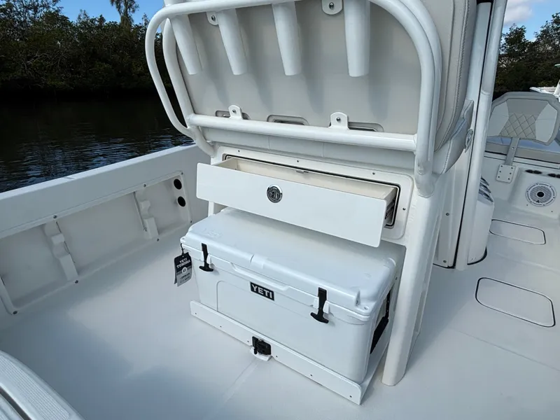 Slide: The Image of 2025 World Cat 235 CC boat with Yeti cooler storage on deck. - 15