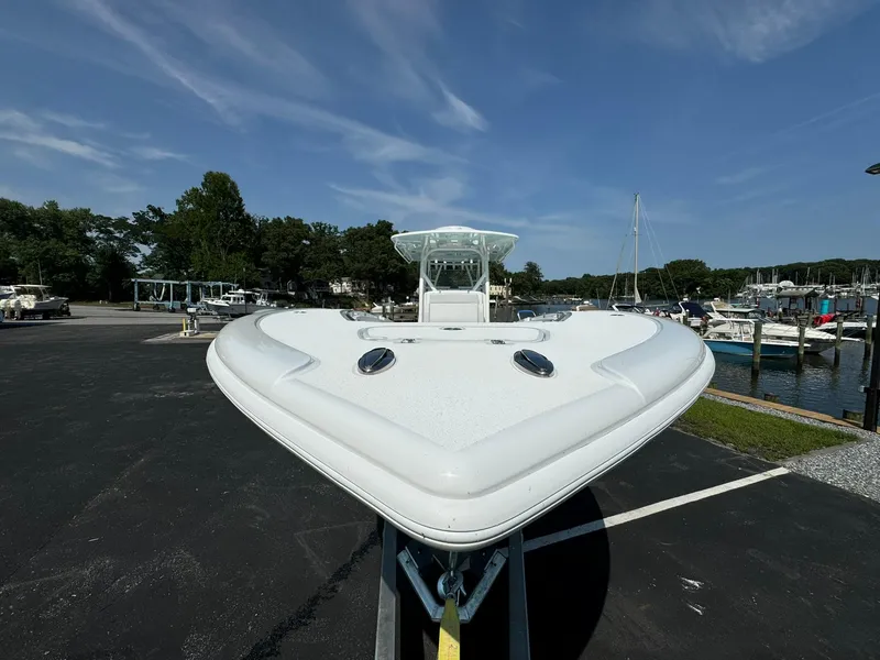 Slide: The Image of 2025 Yellowfin 34 Offshore boat on display at a marina. - 10