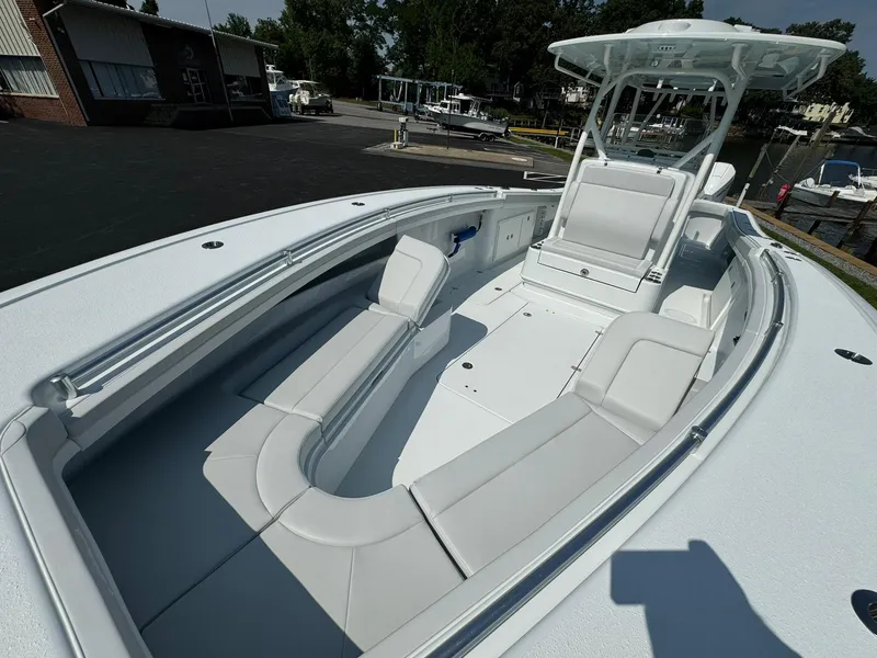 Slide: The Image of 2025 Yellowfin 34 Offshore boat with spacious seating and sleek design. - 12
