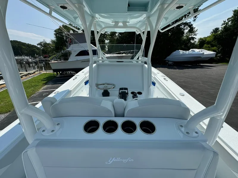 Slide: The Image of 2025 Yellowfin 34 Offshore boat interior with helm and seating area. - 20