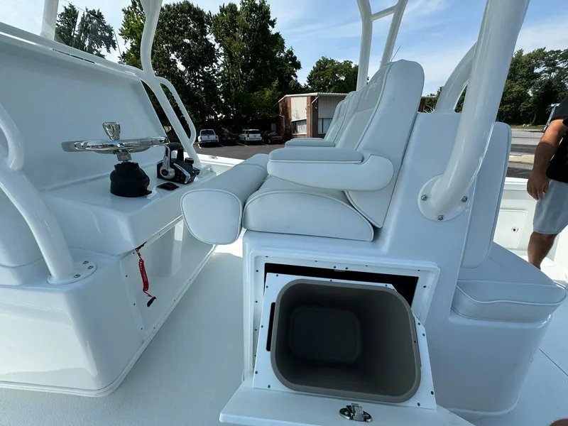Slide: The Image of 2025 Yellowfin 34 Offshore boat interior with white seating and storage compartment. - 40