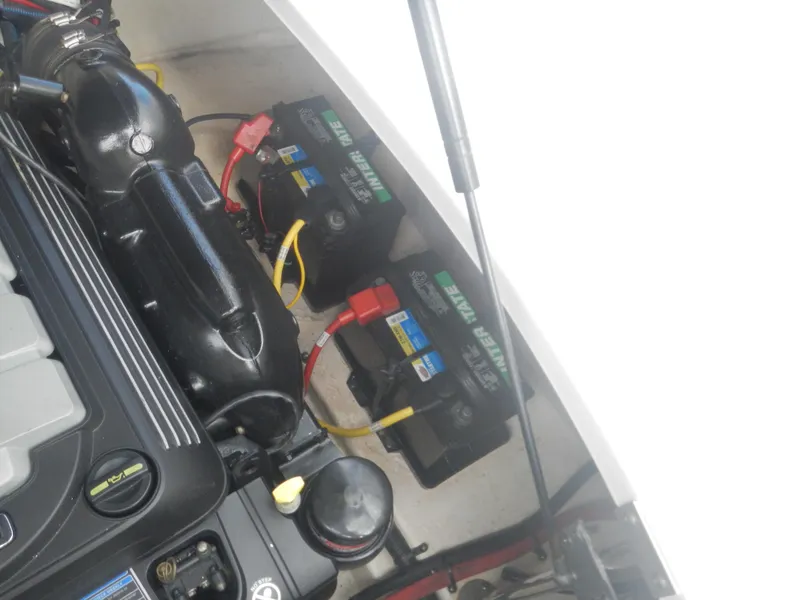 Slide: The Image of 2017 Chaparral 270 Signature boat engine compartment with dual batteries. - 11