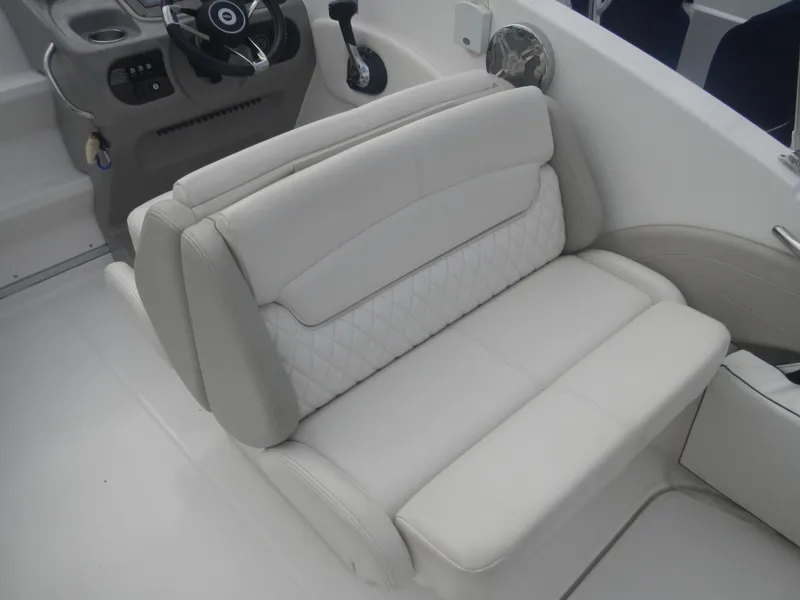 Slide: The Image of 2017 Chaparral 270 Signature boat interior seating, white leather upholstery. - 16