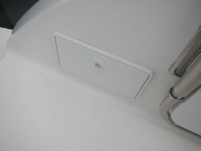 Slide: The Image of 2017 Chaparral 270 Signature boat interior detail with white panel and metal railing. - 19