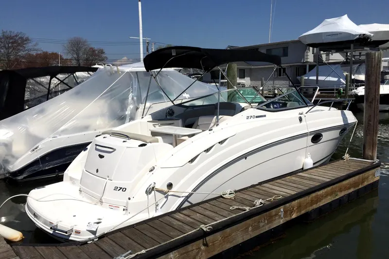 Slide: The Image of 2017 Chaparral 270 Signature boat docked at marina. - 2