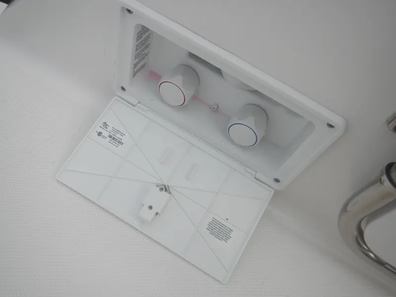 Slide: The Image of 2017 Chaparral 270 Signature boat water control panel with two knobs. - 20