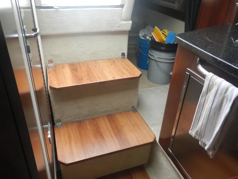 Slide: The Image of Interior stairs of 2017 Chaparral 270 Signature boat with wood finish. - 35