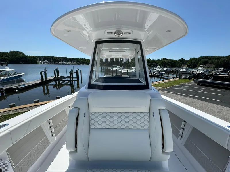 Slide: The Image of 2024 Jupiter 340LS boat interior with waterfront view, showcasing sleek design and modern features. - 21