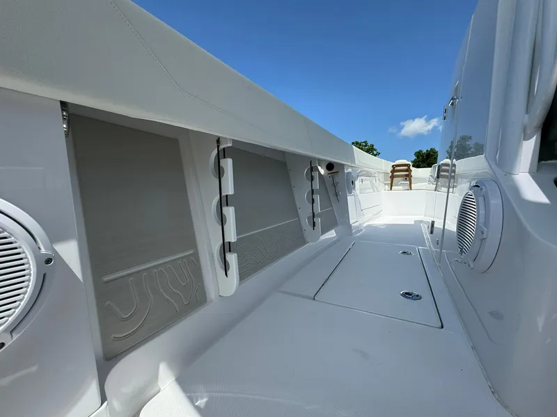 Slide: The Image of 2024 Jupiter 340LS boat interior with sleek design and modern features under clear blue sky. - 32