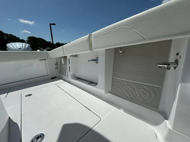Slide: The Image of 2024 Jupiter 340LS boat interior with sleek white design and modern fittings. - 33