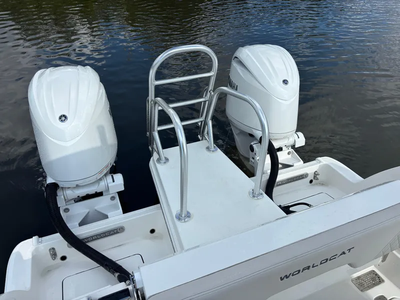 Slide: The Image of 2025 World Cat 260 CC-X boat with dual engines on water. - 11